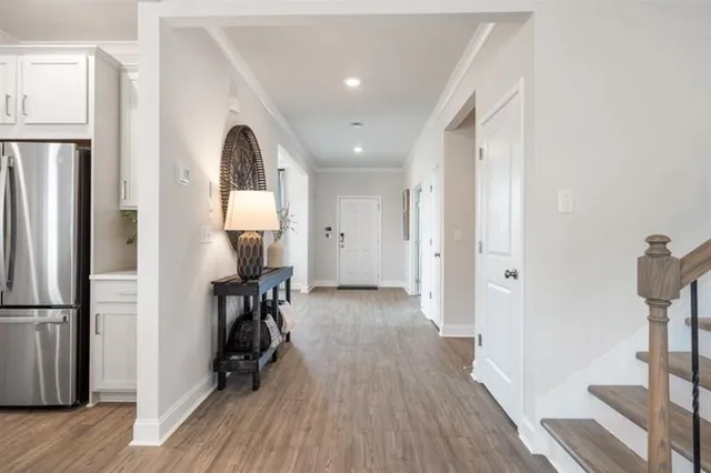 a living room with furniture a fireplace and a large window