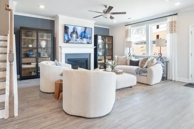 a living room with furniture fireplace and window