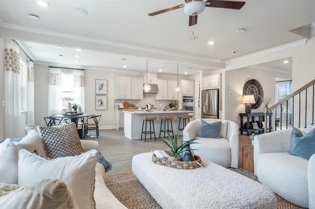 a view of a livingroom with furniture and wooden floor