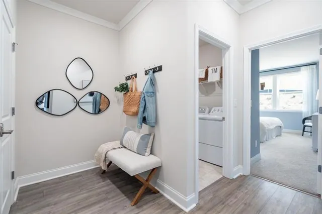 a bedroom with a bed and a table lamp