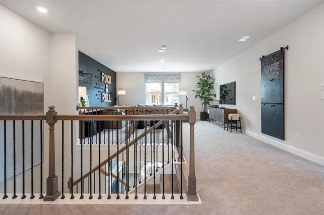 a bedroom with furniture and a large window