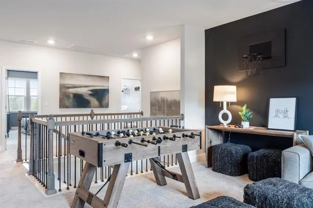 a living room with furniture and kitchen view