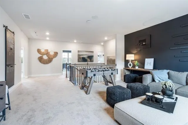 a spacious bedroom with a large bed and a couch