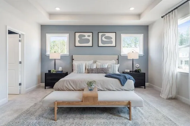 a bedroom with a bed and large window