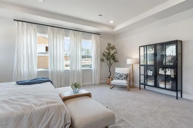 a spacious bathroom with double sink and a mirror