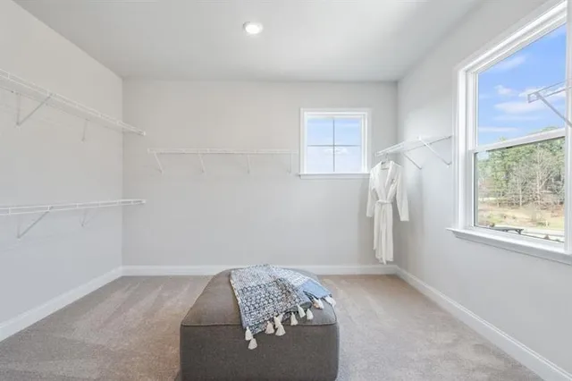 a bedroom with bed and wooden floor