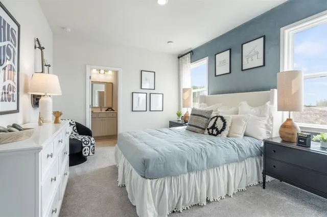 a bathroom with a sink toilet vanity and shower