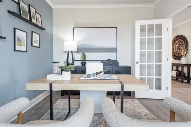 a view of a dining room with furniture and chandelier