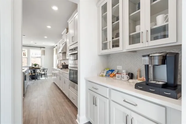 a kitchen with a sink and cabinets