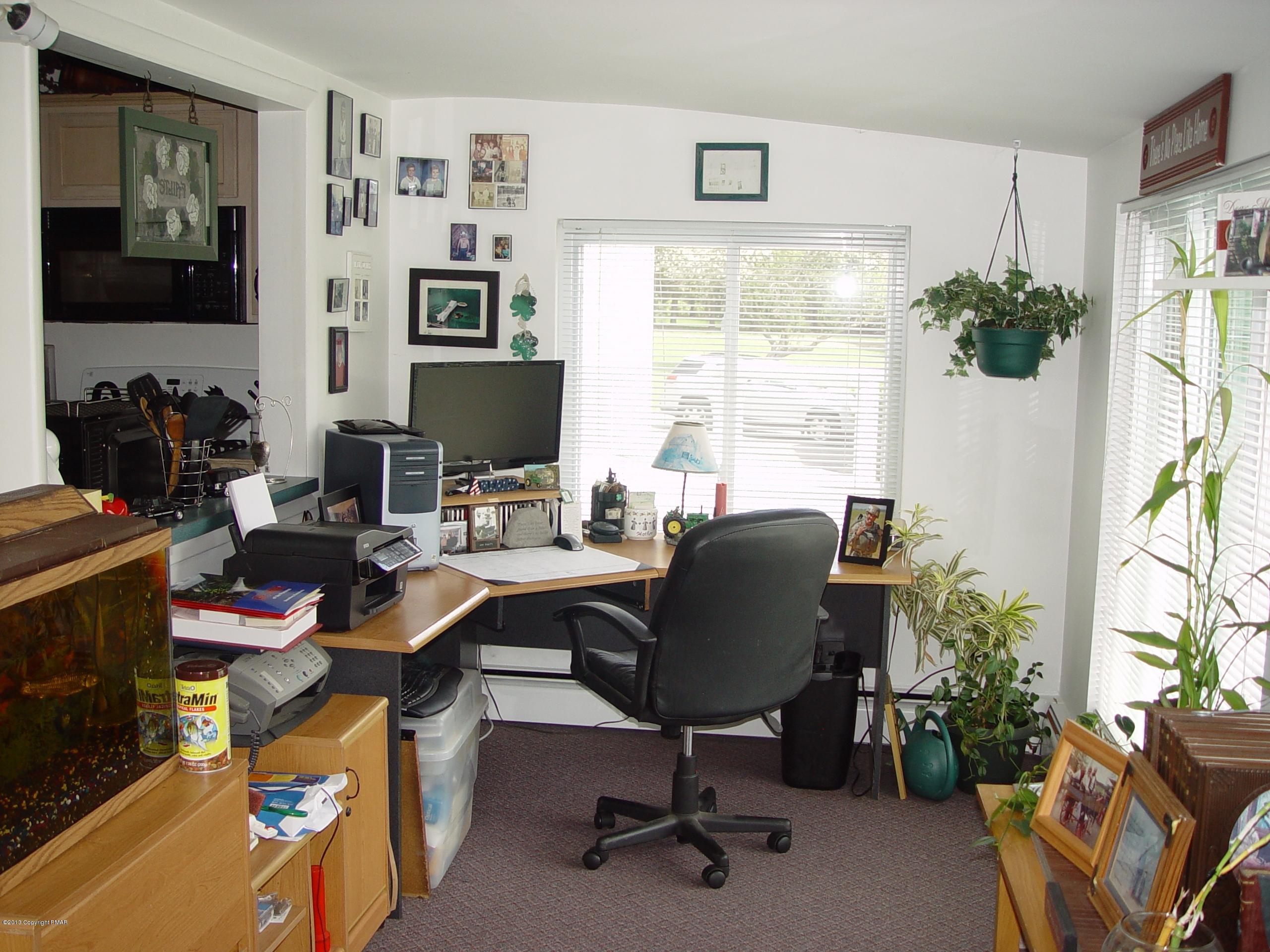 396 Good Times Road Kunkletown, PA 18058 - Photo 24 of 45 a view of a workspace with furniture and a window