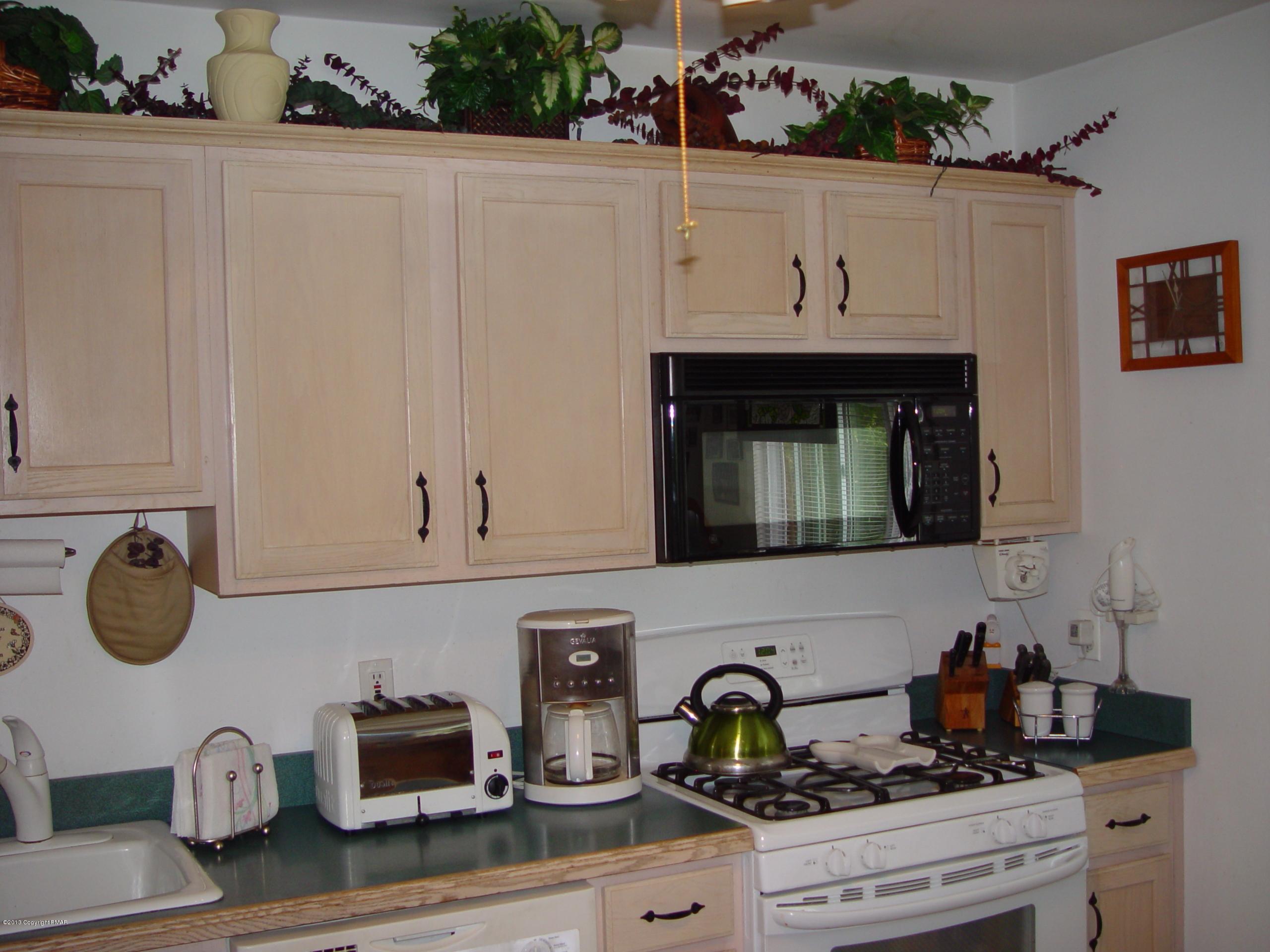 396 Good Times Road Kunkletown, PA 18058 - Photo 26 of 45 a kitchen with white cabinets and appliances