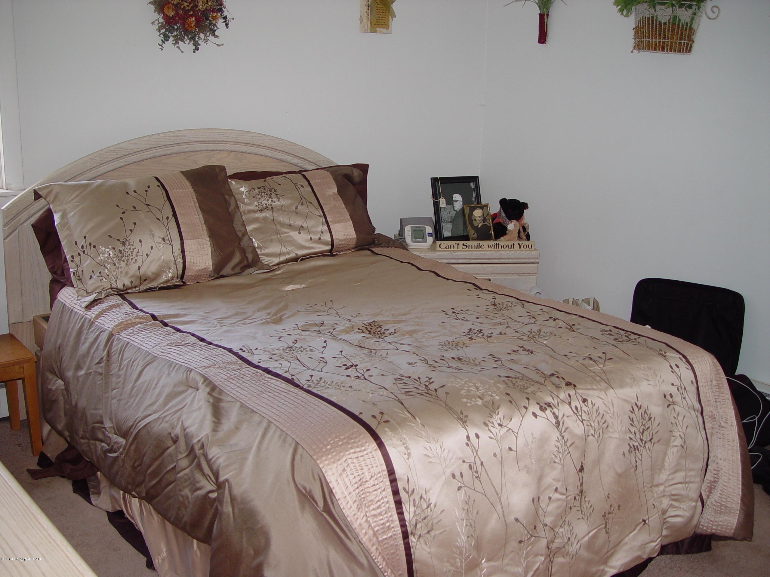 396 Good Times Road Kunkletown, PA 18058 - Photo 28 of 45 a bedroom with a bed and wooden floor