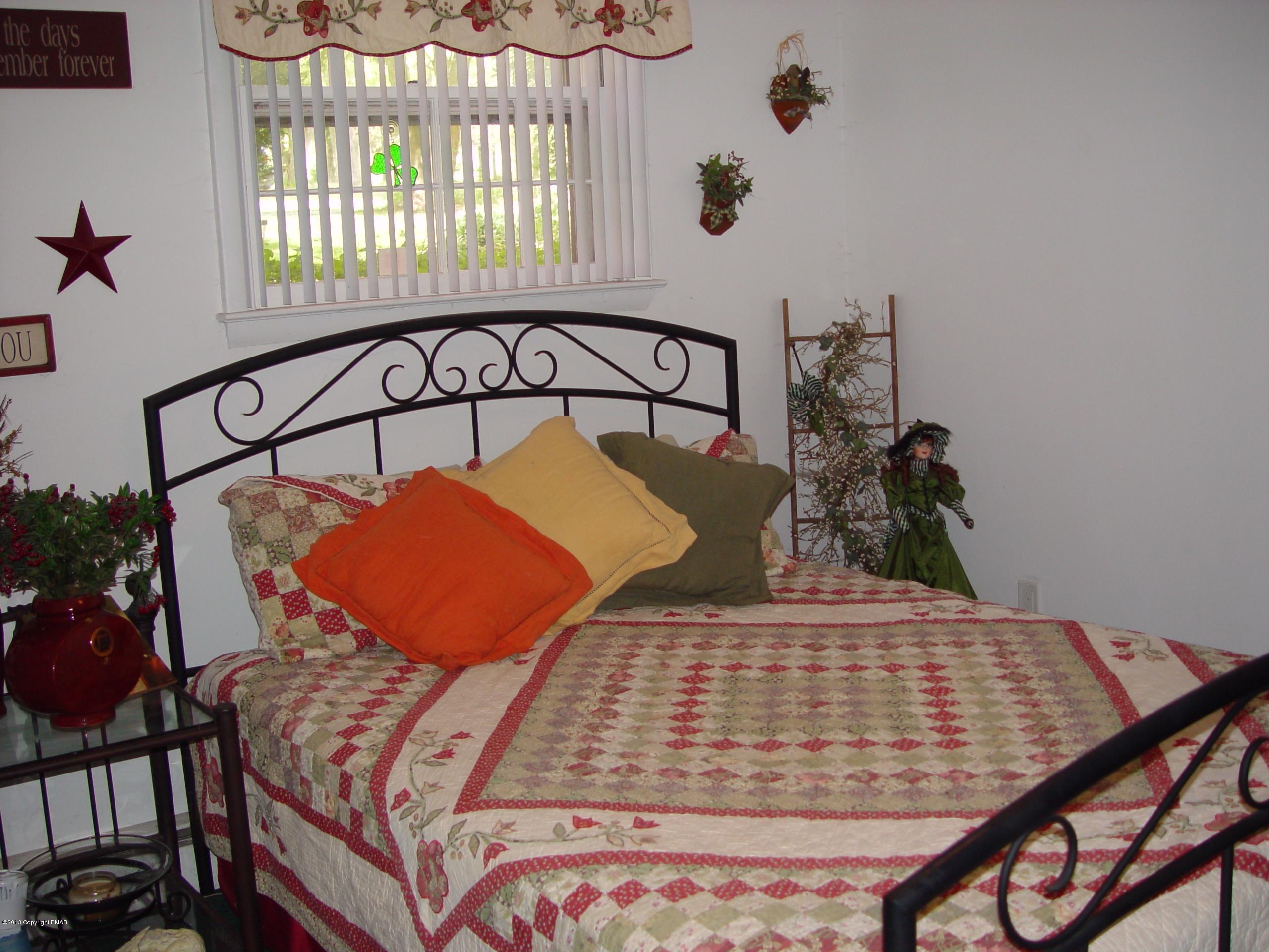 396 Good Times Road Kunkletown, PA 18058 - Photo 33 of 45 a bedroom with a bed and window