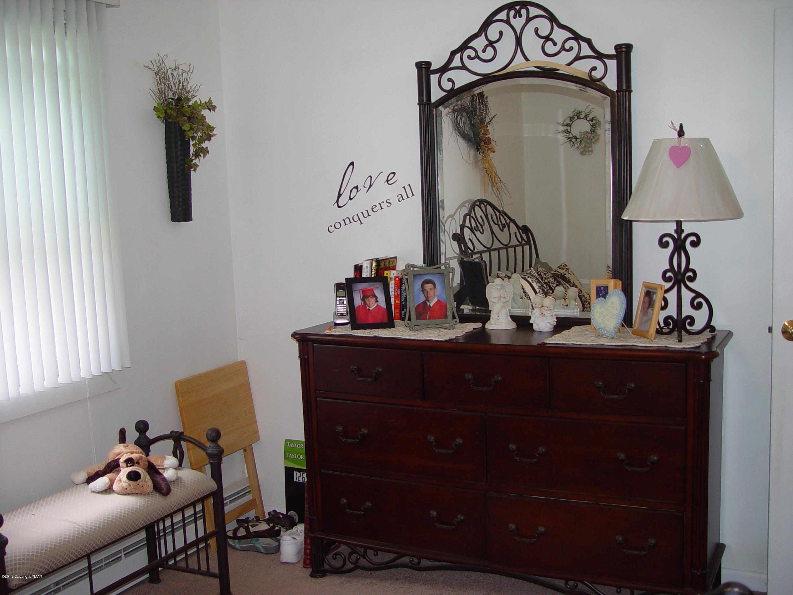 396 Good Times Road Kunkletown, PA 18058 - Photo 34 of 45 a bed room with a mirror and a dresser