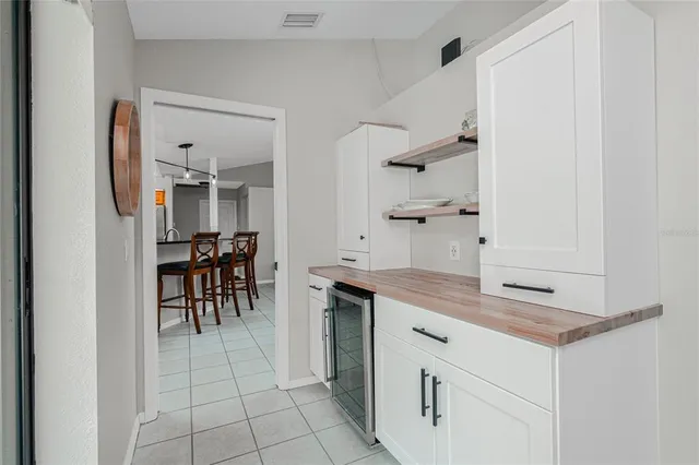 a spacious bathroom with a granite countertop sink a mirror and a shower