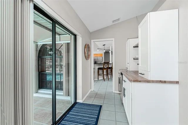 a view of a kitchen with a sink and cabinets