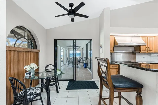 a kitchen with stainless steel appliances granite countertop a sink a stove and refrigerator