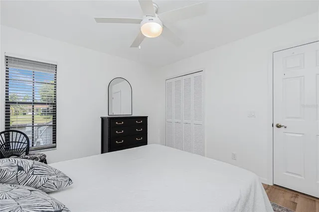 a spacious bathroom with a double vanity sink a mirror a bathtub and shower