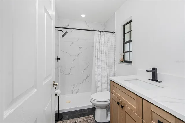 a view of entryway with furniture and wooden floor