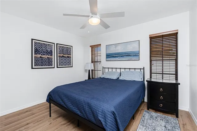a view of a swimming pool with a patio and a tub