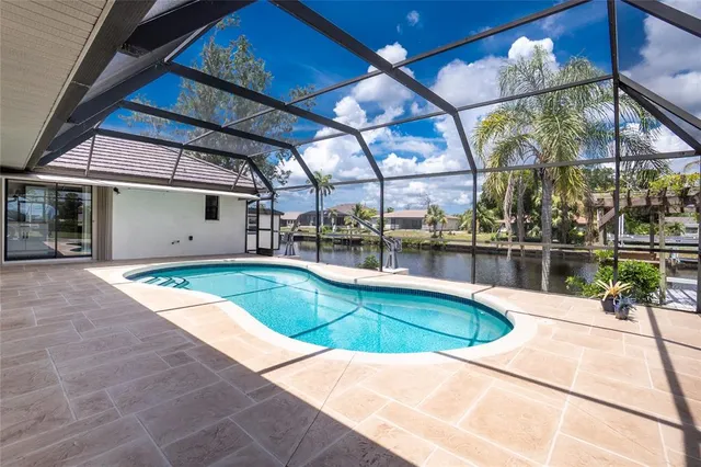 a view of a house with backyard porch and sitting area