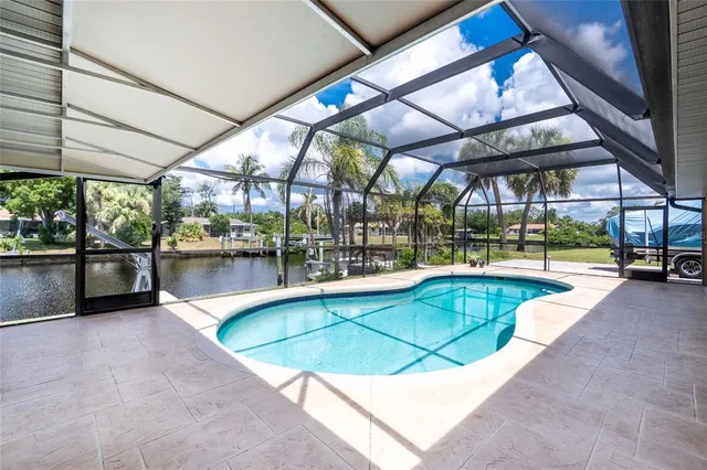 an aerial view of a house with a lake view