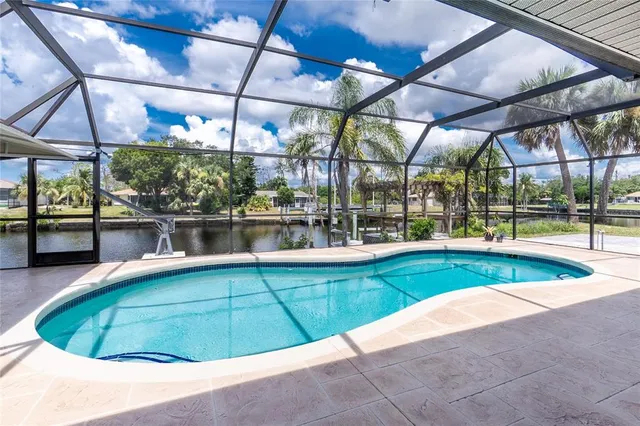 an aerial view of a house with a swimming pool