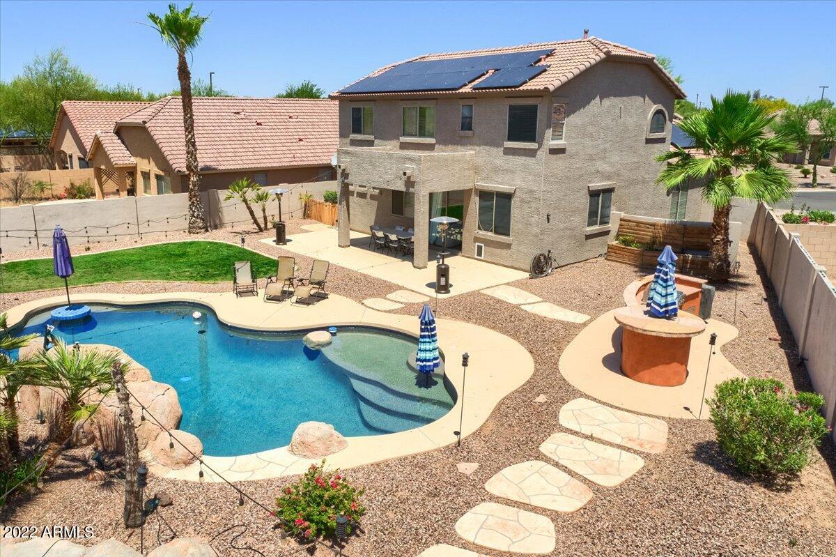 3889 East Timberline Road Gilbert, AZ 85297 - Photo 1 of 25 a view of a house with backyard porch and furniture