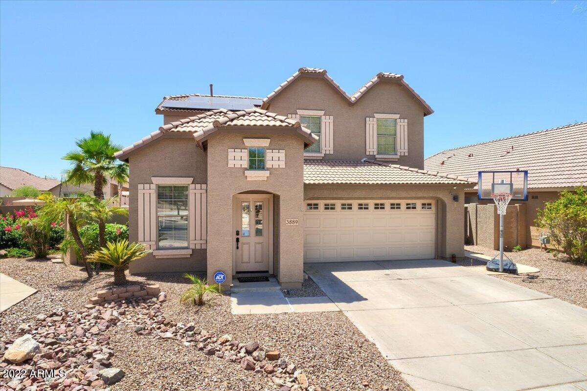 3889 East Timberline Road Gilbert, AZ 85297 - Photo 18 of 25 a front view of a house with a yard