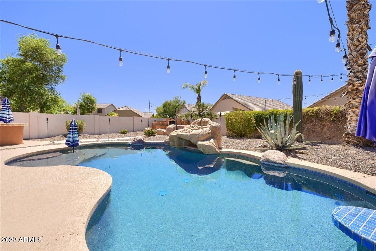 3889 East Timberline Road Gilbert, AZ 85297 - Photo 20 of 25 a living room with patio furniture