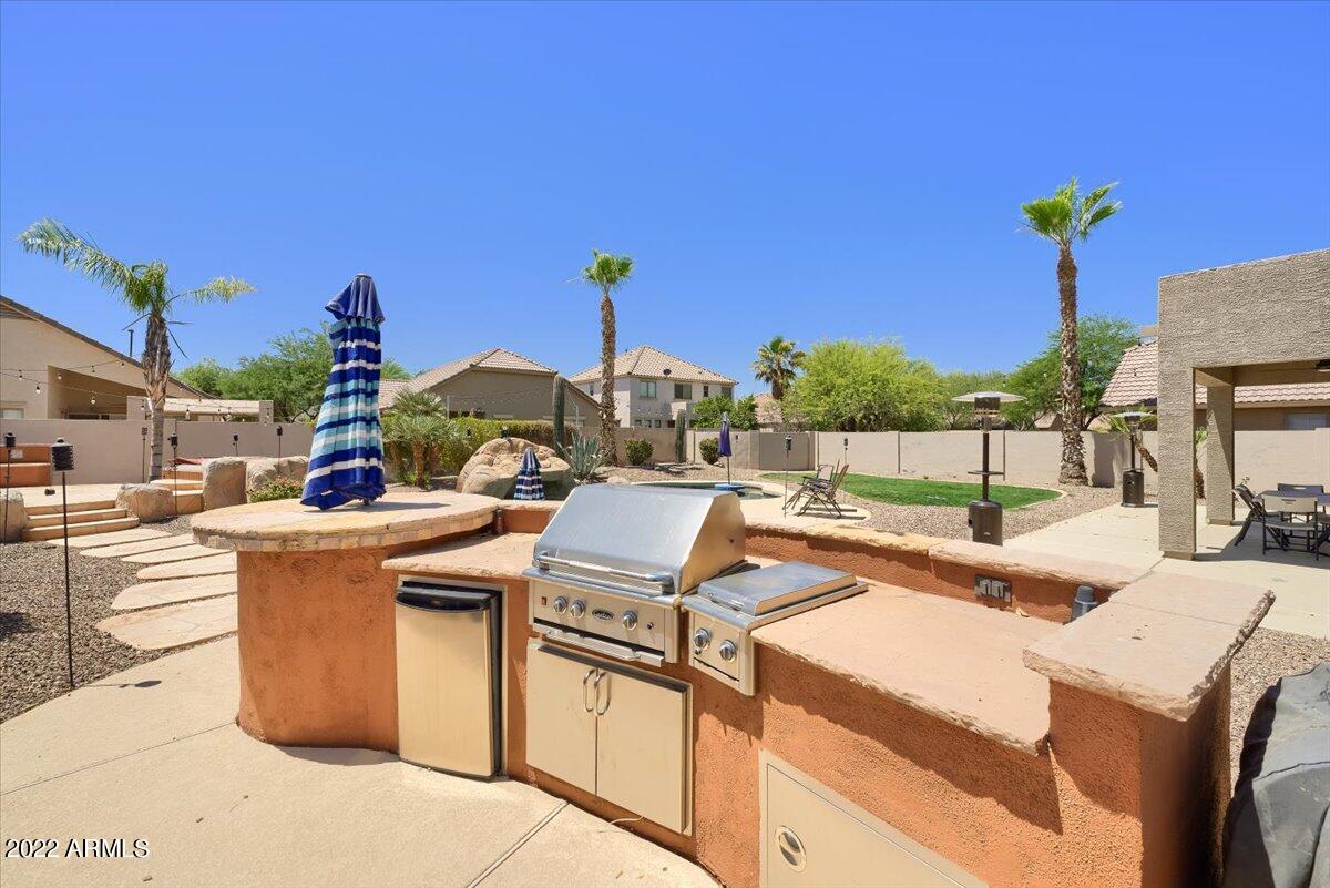3889 East Timberline Road Gilbert, AZ 85297 - Photo 25 of 25 a view of a kitchen with a stove