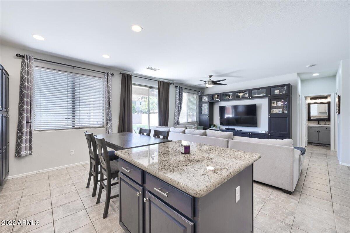 3889 East Timberline Road Gilbert, AZ 85297 - Photo 7 of 25 a view of a dining room with furniture
