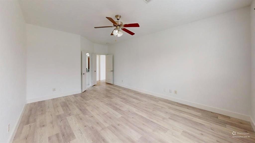 101 Rocky Pine Road McKinney, TX 75072 - Photo 33 of 39 a view of a room with wooden floor and ceiling fan