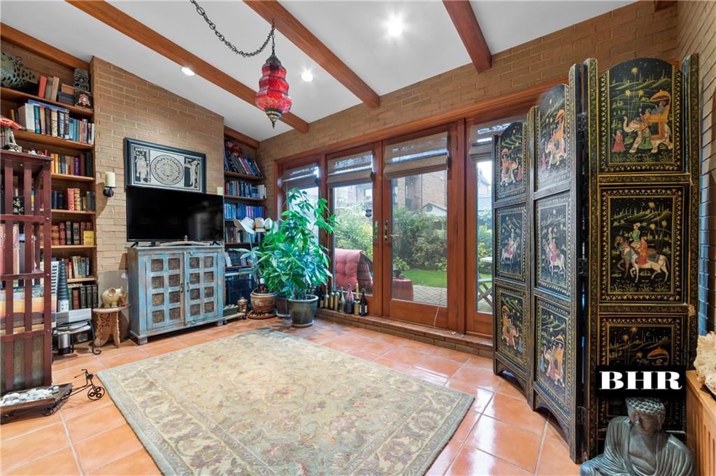 179 Norfolk Street Brooklyn, NY 11235 - Photo 11 of 31 a very nice looking room with a flat screen tv