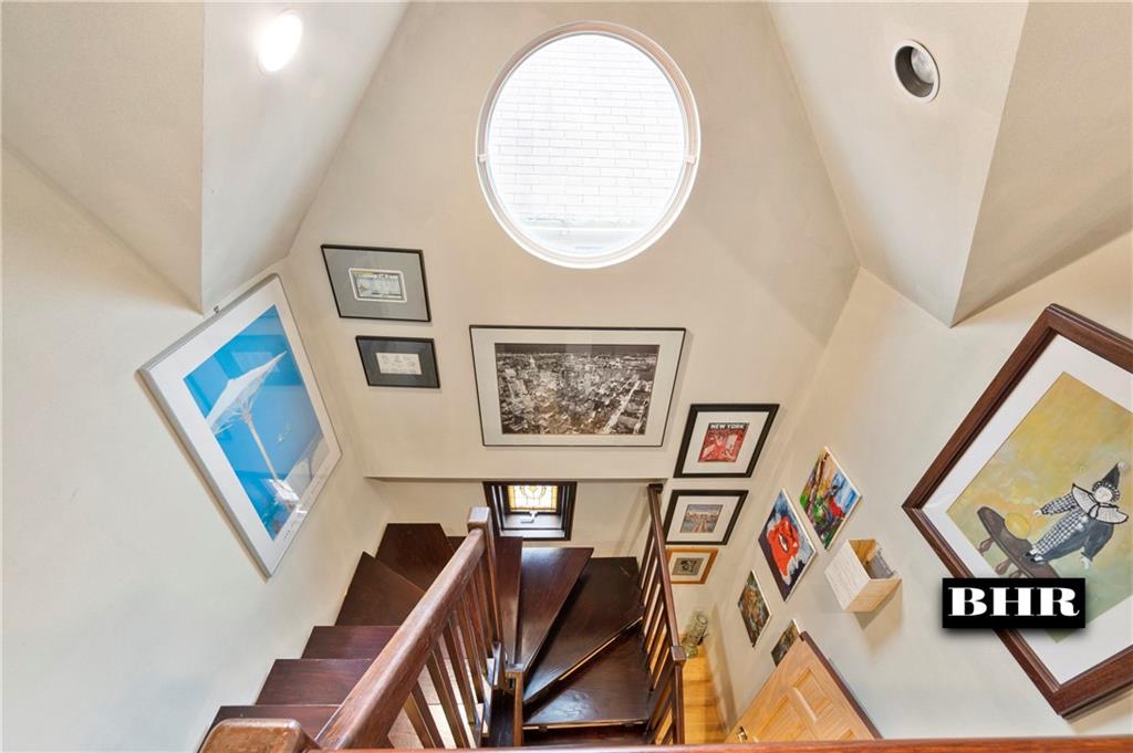 179 Norfolk Street Brooklyn, NY 11235 - Photo 16 of 31 a view of a livingroom with furniture and a flat screen tv