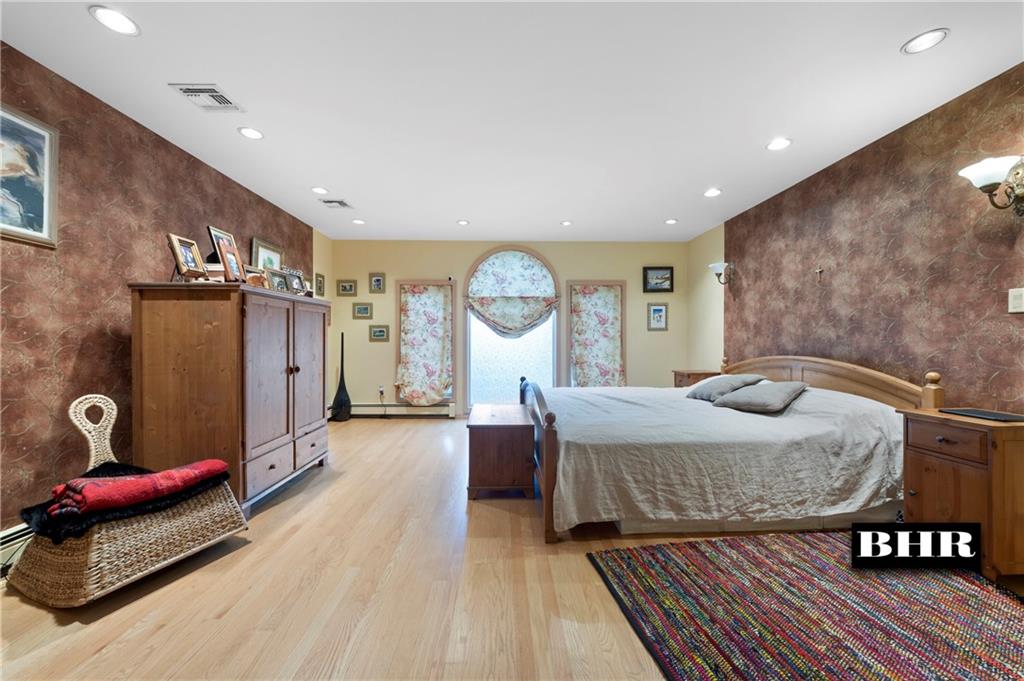 179 Norfolk Street Brooklyn, NY 11235 - Photo 18 of 31 a living room with furniture and a table