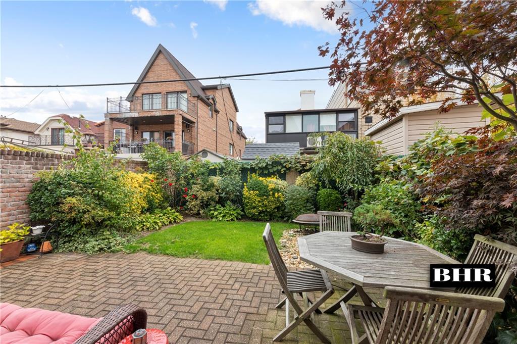 179 Norfolk Street Brooklyn, NY 11235 - Photo 27 of 31 a house view with a seating space and garden view