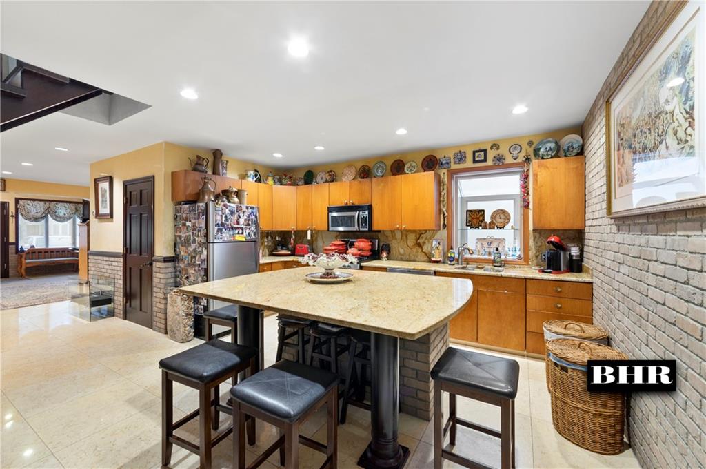 179 Norfolk Street Brooklyn, NY 11235 - Photo 9 of 31 a dining table with chairs and window