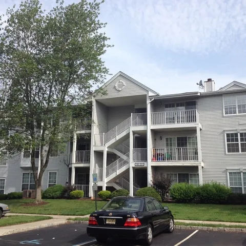 a front view of a building with street view
