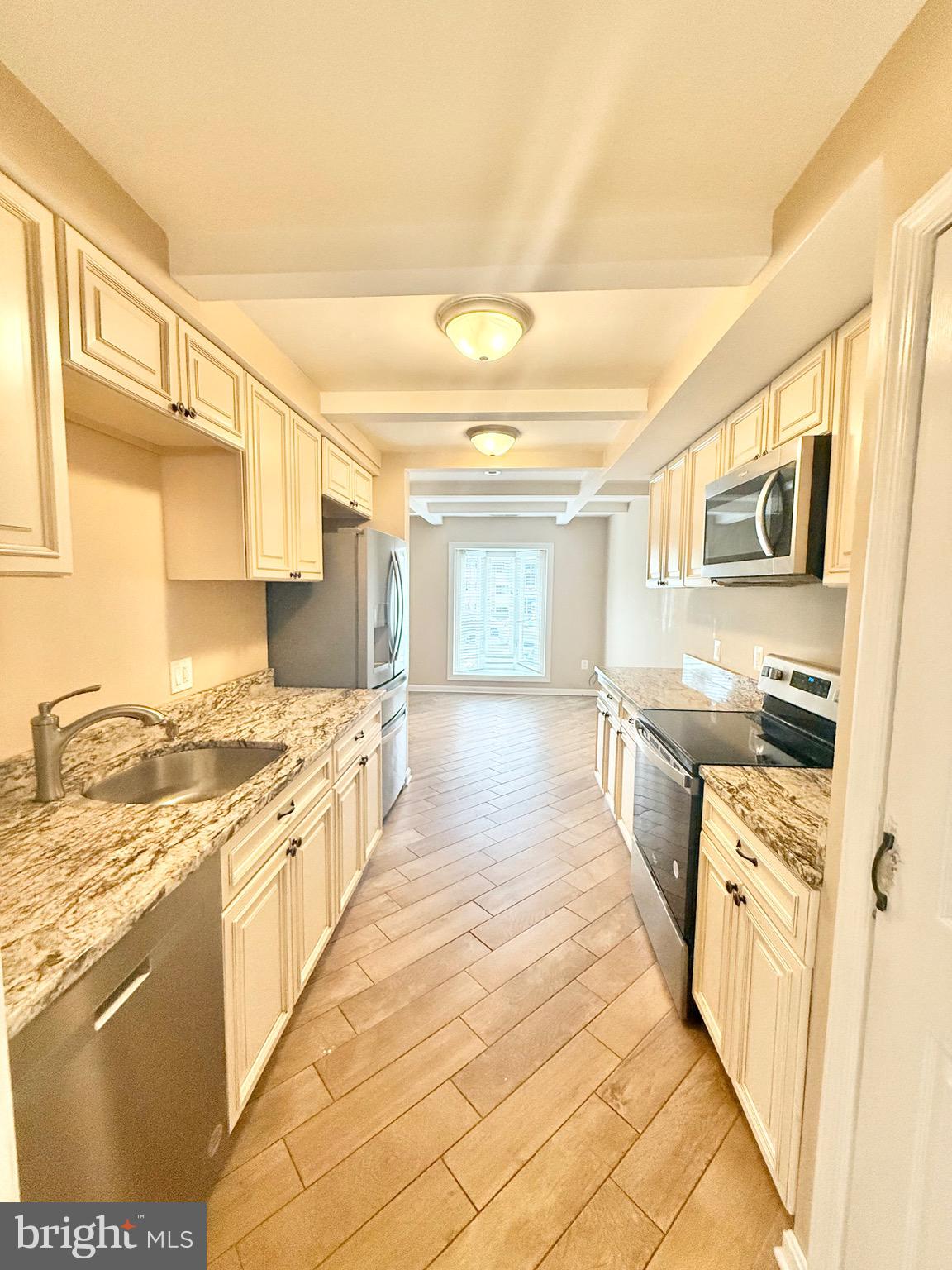 5439 Richenbacher Avenue Alexandria, VA 22304 - Photo 5 of 23 a large kitchen with stainless steel appliances granite countertop a stove and cabinets