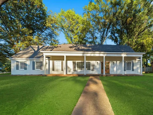 front view of a house with a yard