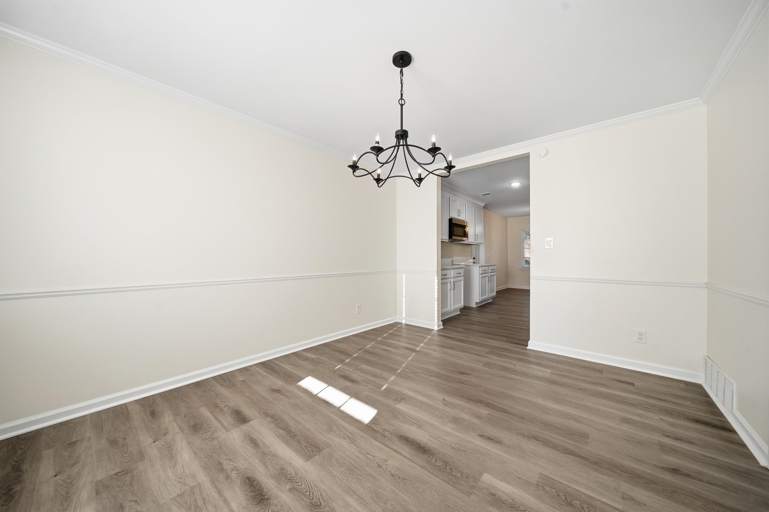 6246 Quince Road Memphis, TN 38119 - Photo 11 of 27 a view of a room with wooden floor