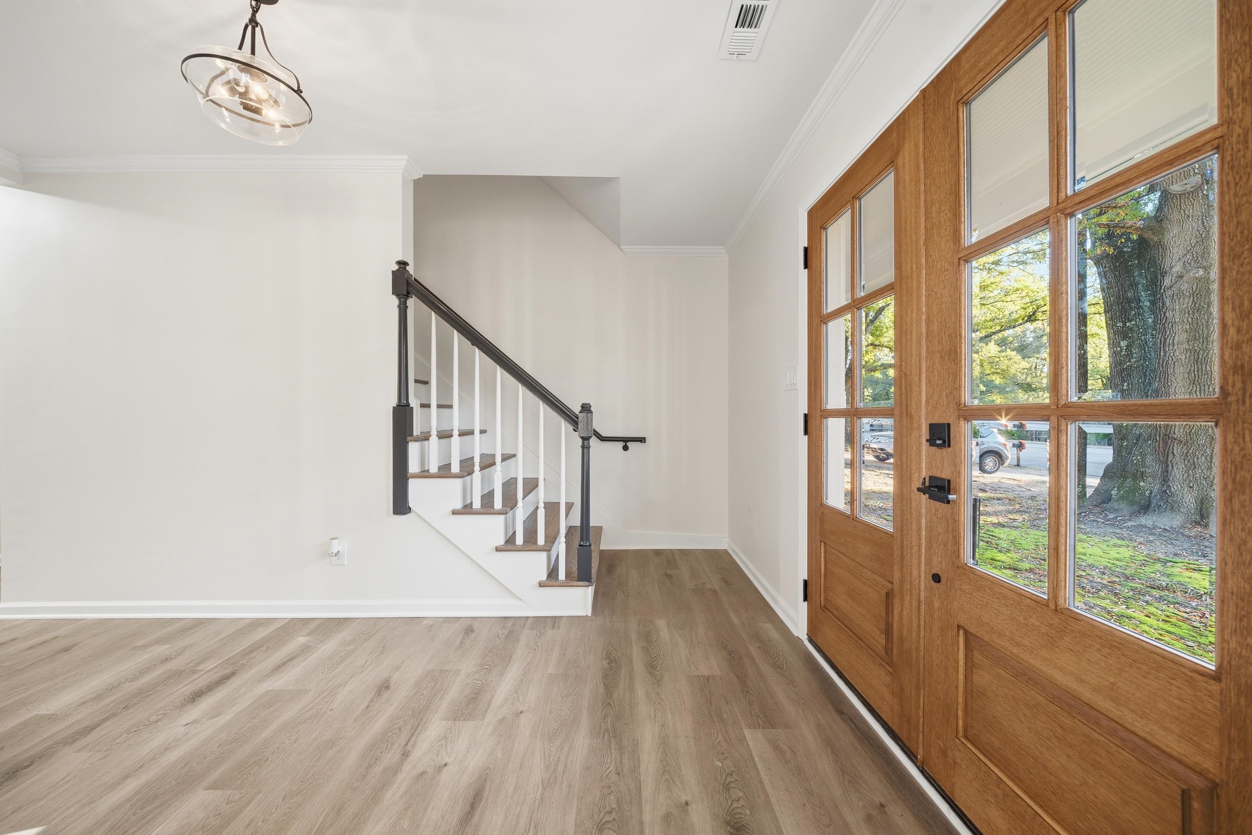 6246 Quince Road Memphis, TN 38119 - Photo 14 of 27 a view of entryway and hall with wooden floor