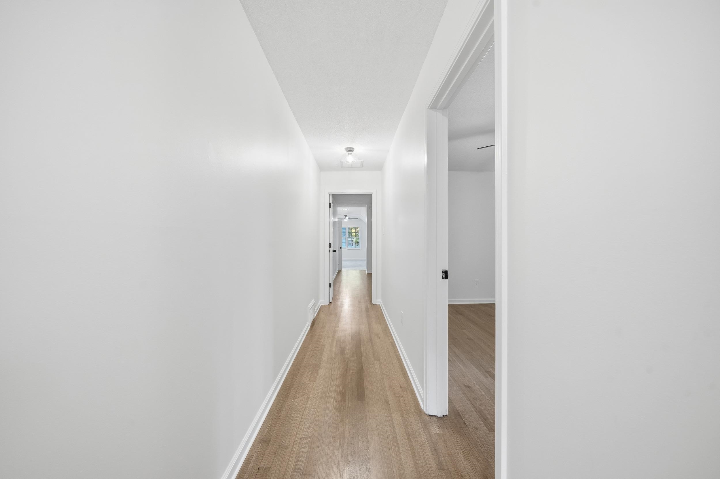 6246 Quince Road Memphis, TN 38119 - Photo 17 of 27 a view of a hallway with wooden floor