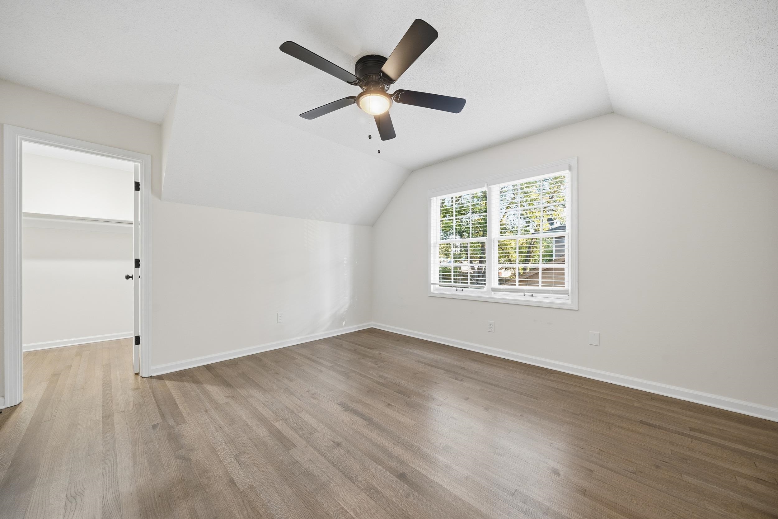 6246 Quince Road Memphis, TN 38119 - Photo 21 of 27 wooden floor in an empty room with a window