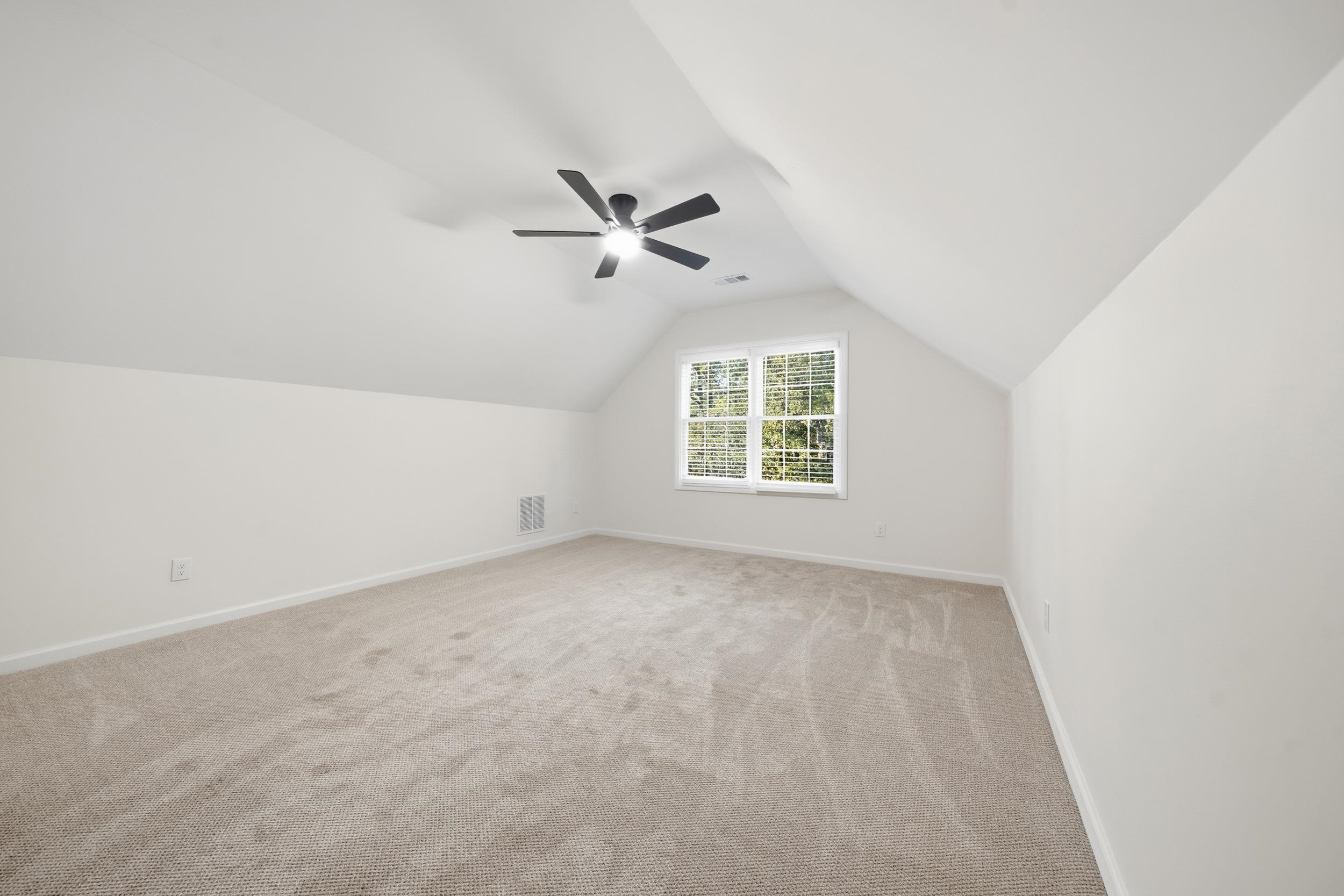 6246 Quince Road Memphis, TN 38119 - Photo 22 of 27 an empty room with windows and fan