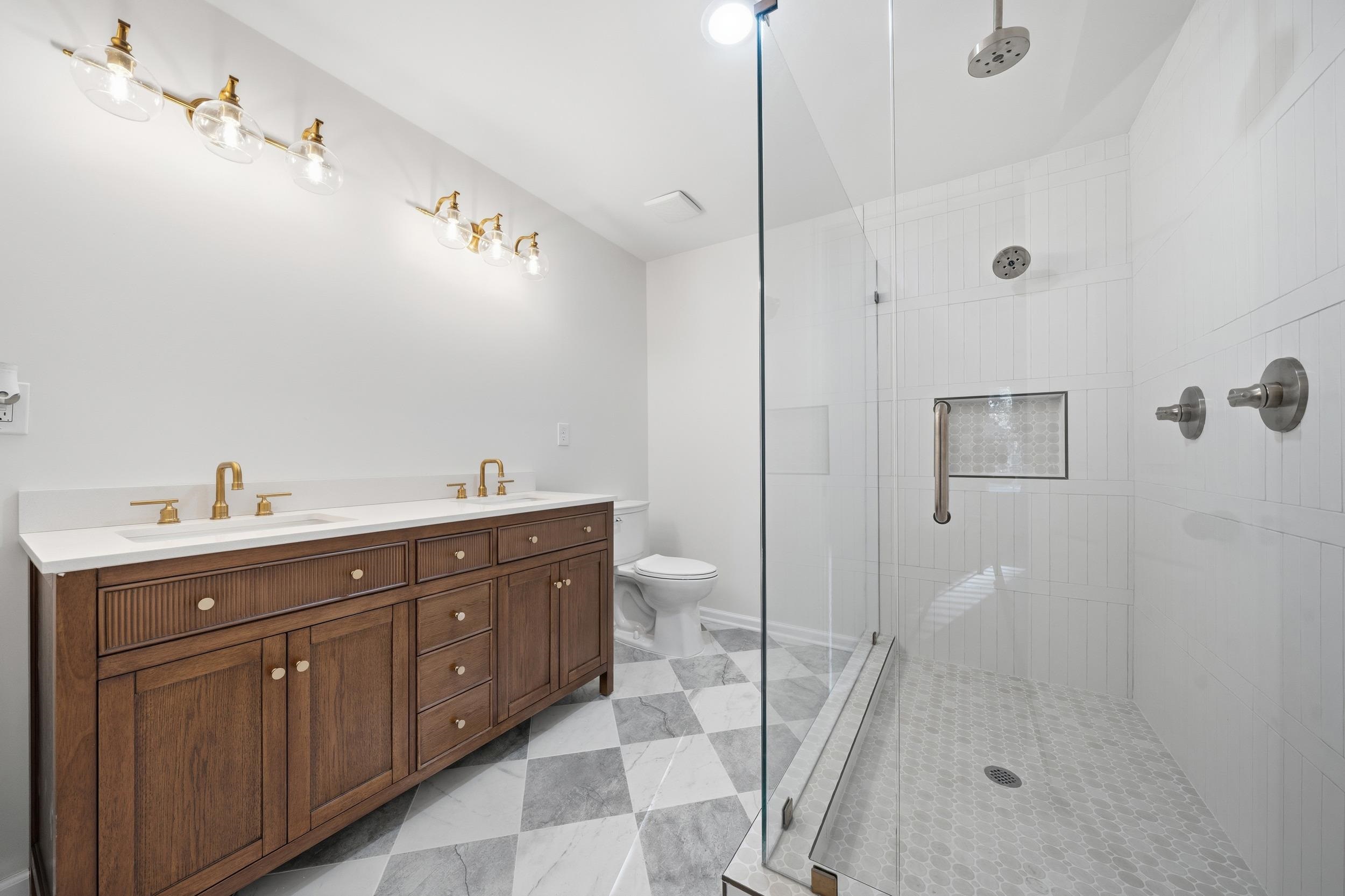 6246 Quince Road Memphis, TN 38119 - Photo 7 of 27 a spacious bathroom with a granite countertop sink a toilet and a shower