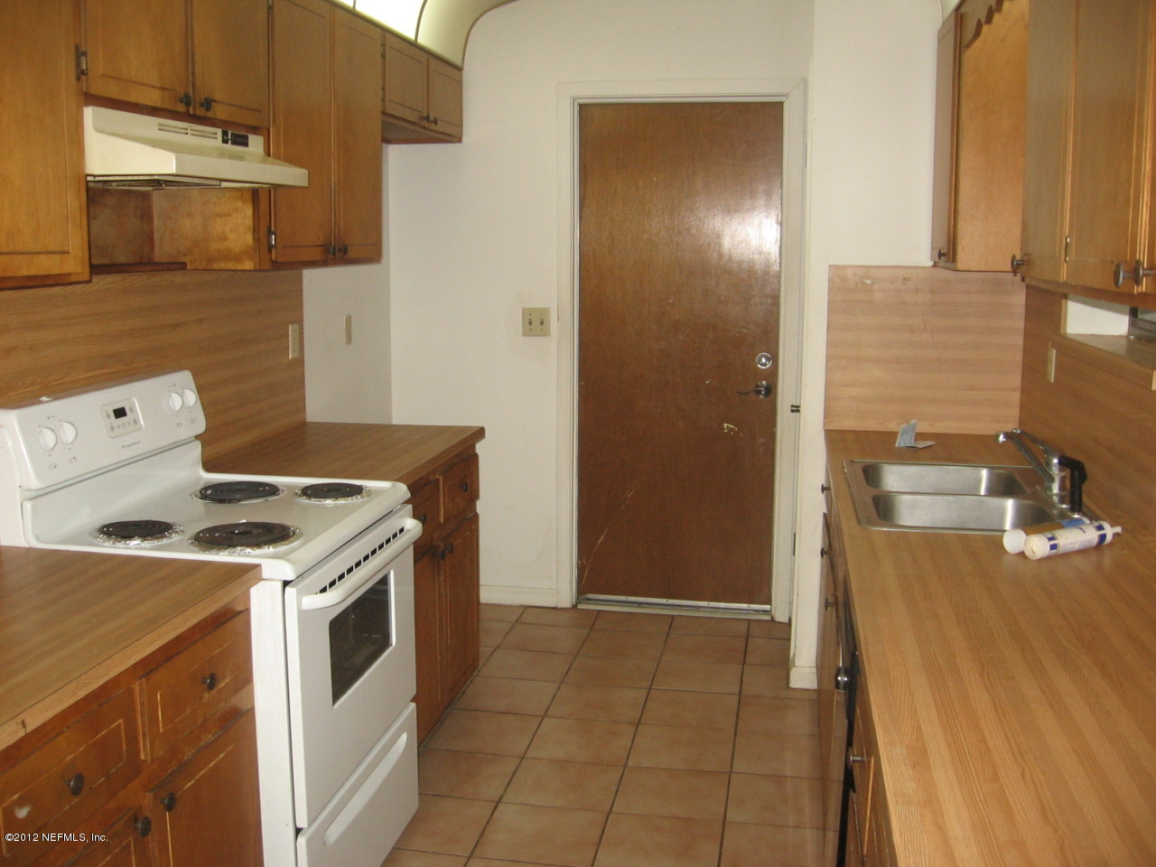 1952 Rothbury Drive Jacksonville, FL 32221 - Photo 2 of 9 a kitchen with a stove and a refrigerator
