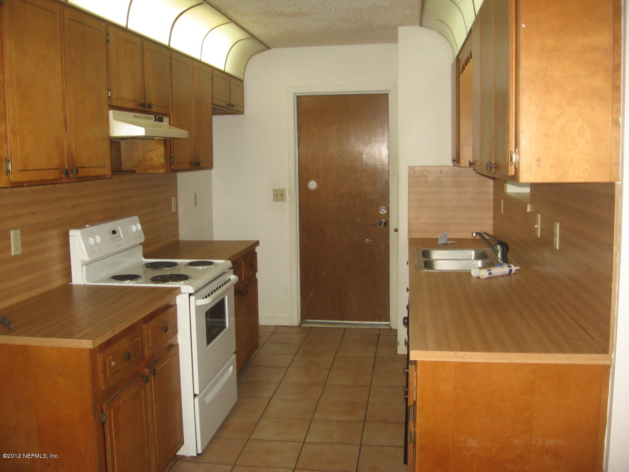 1952 Rothbury Drive Jacksonville, FL 32221 - Photo 3 of 9 a kitchen with a refrigerator and a stove