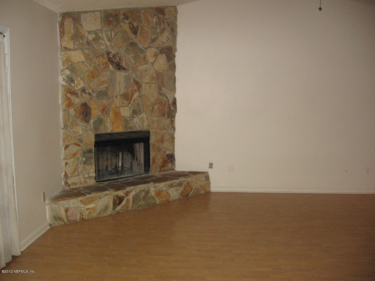 1952 Rothbury Drive Jacksonville, FL 32221 - Photo 5 of 9 an empty room with a fireplace